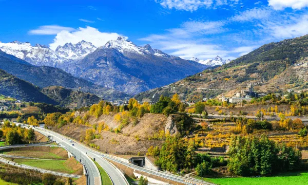 The wine-growing landscape of the Aosta Valley with snowy peaks